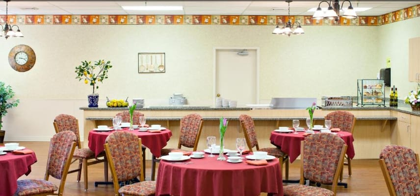 Brightly decorated dining room with round tables