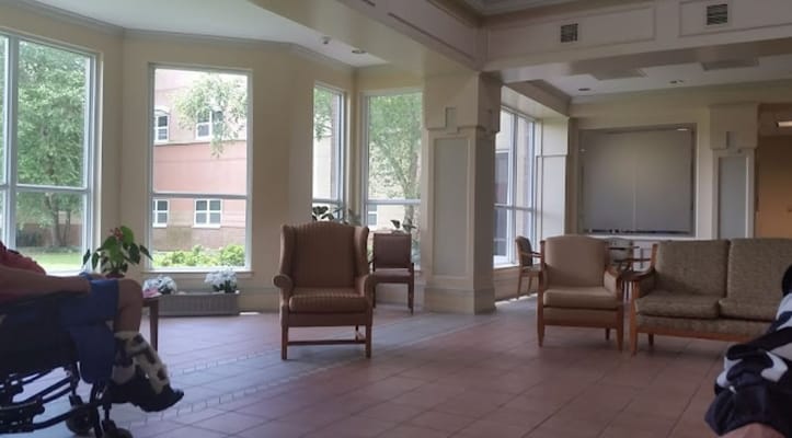 Spacious living room with seating area and large windows