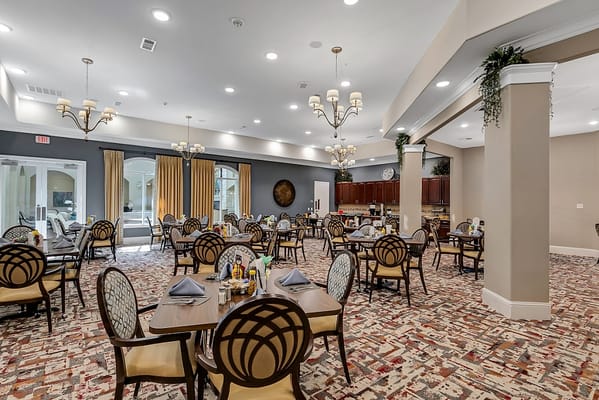 Spacious dining room with elegant decor and table settings