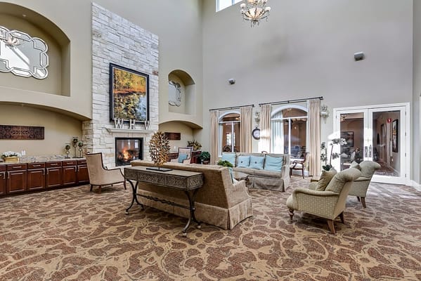 Spacious common area with seating and a fireplace