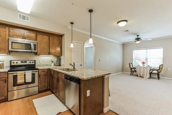 Bright interior view of a modern kitchen and living area