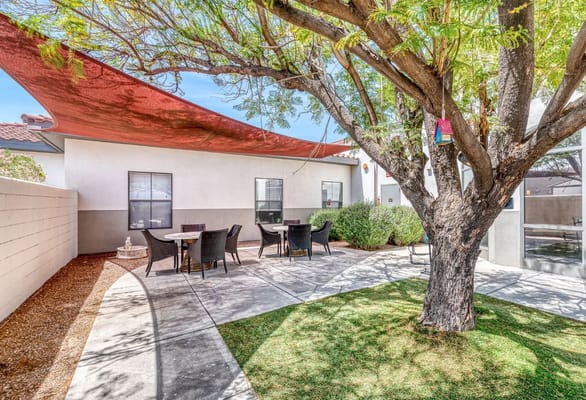 Outdoor space with seating area and shaded pathways