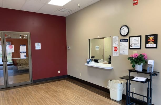 Interior view of the lobby with a reception area and seating