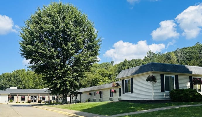 Exterior of Worthington Healthcare Center with a large tree