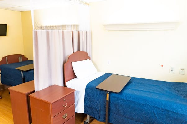 Private resident room with a single bed and furniture