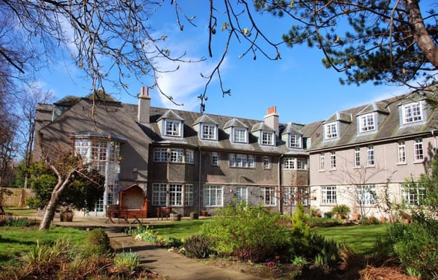Exterior view of the Colinton Care Home surrounded by gardens