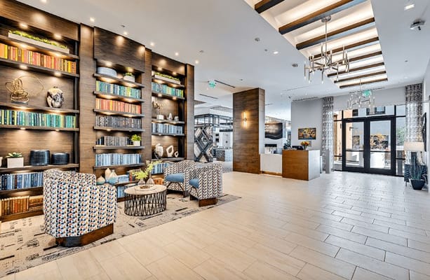 Bright and inviting common area with seating and bookshelves