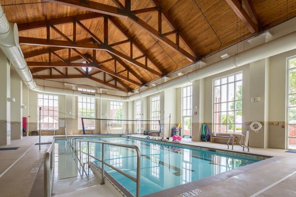 Indoor swimming pool with a wooden ceiling