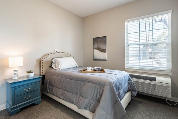 Cozy private resident room with a bed and decor