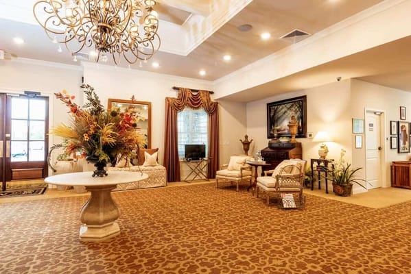 Welcoming lobby with seating and decorative flowers