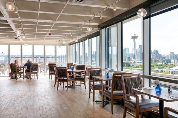 Dining area with tables and views of the city skyline