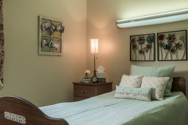 Cozy private room with a bed and decorative elements