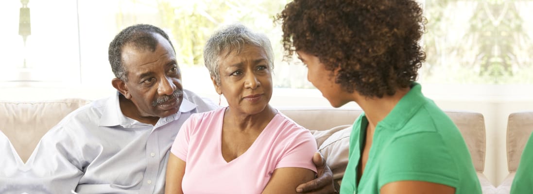 Residents and staff engaged in conversation