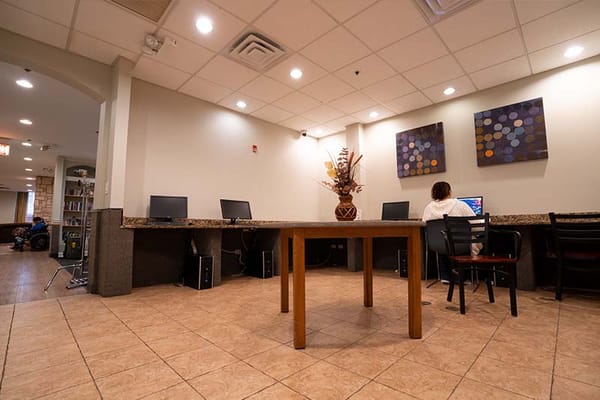 Common area with a computer station and a resident