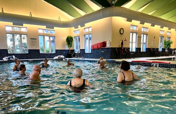 Residents participating in a water exercise class