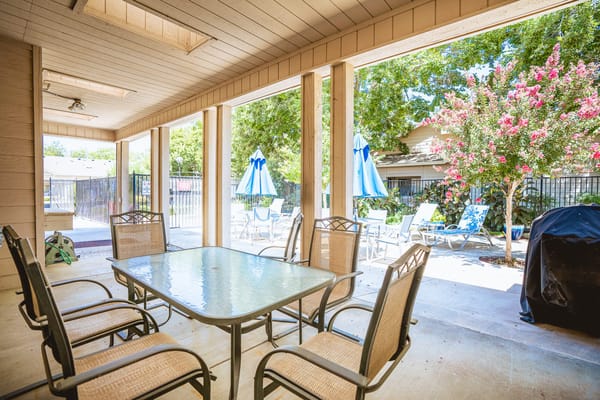 Outdoor patio area with seating and umbrellas
