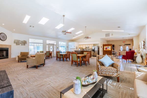 Bright common area with seating and kitchen access