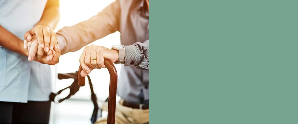 Staff assisting resident with mobility