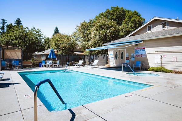 Swimming pool area with lounge chairs