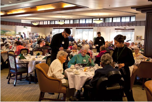 Residents enjoying a meal in the dining room