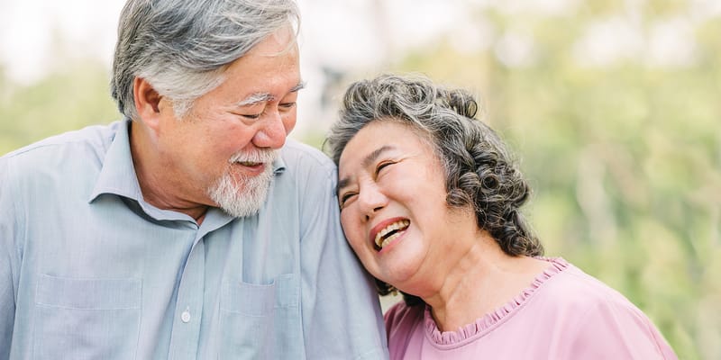 Couple smiling together in a garden