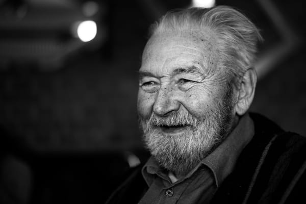 Smiling elderly man with white beard