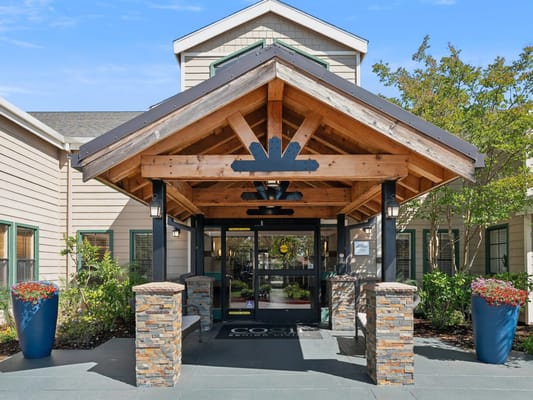 Entrance of Cogir of Vacaville with rustic architecture