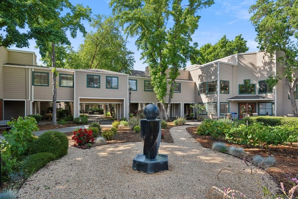 Garden and exterior view of the facility with sculptures