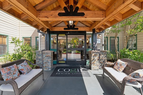 Entrance of Cogir Senior Living with outdoor seating