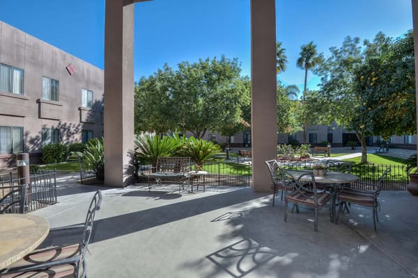 Outdoor garden area with seating and landscaping