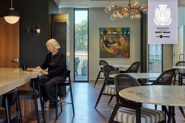 A resident enjoying time in a stylish common area