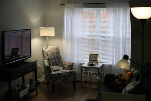 Cozy living area with armchair and lamp