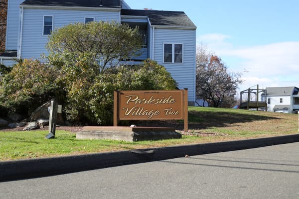 Sign for Parkside Village in outdoor landscape