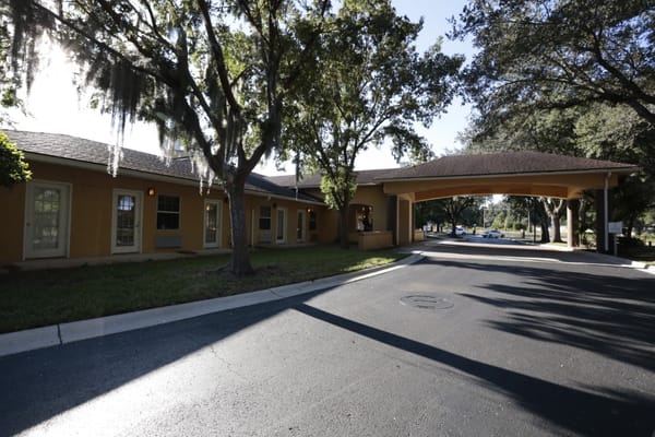 Building exterior with entrance and landscaping