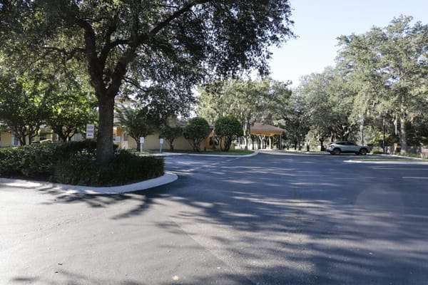 Exterior view of the facility entrance and parking area