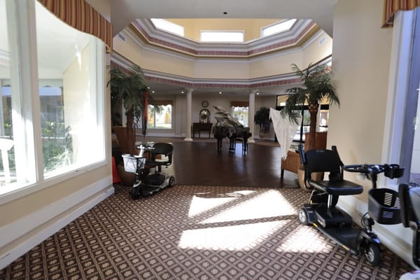 Interior view of a common area with mobility scooters
