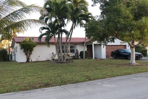 Exterior view of a single-story facility with landscaping