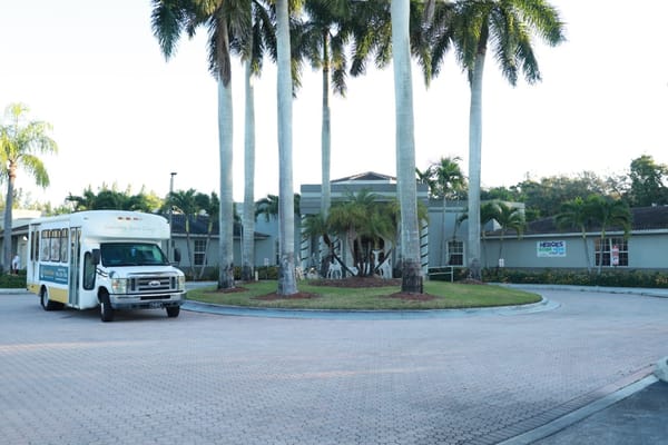Exterior view of the facility with transportation vehicle