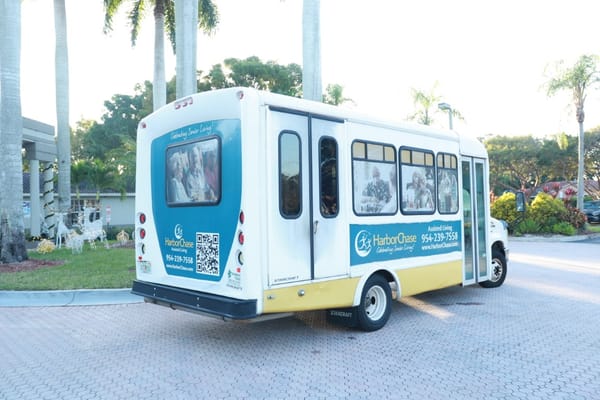 Facility transport vehicle in a landscaped area