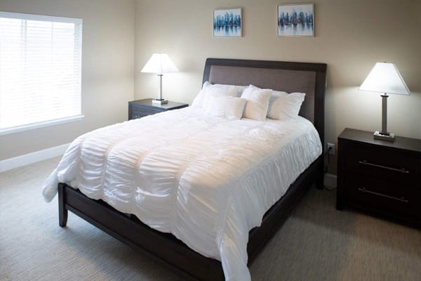 Cozy bedroom with a large bed and lamps