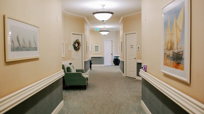 Interior hallway adorned with art and lighting