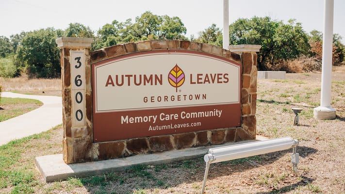 Entrance sign for Autumn Leaves Memory Care Community
