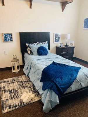 Cozy private resident room with blue accents