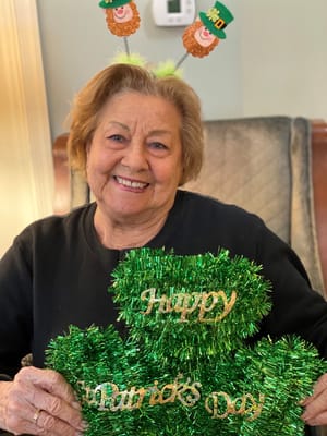 Resident celebrating St. Patrick's Day with decorations