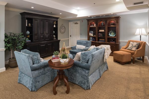 Cozy common area with seating and bookshelves
