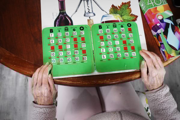 Resident playing bingo at a table