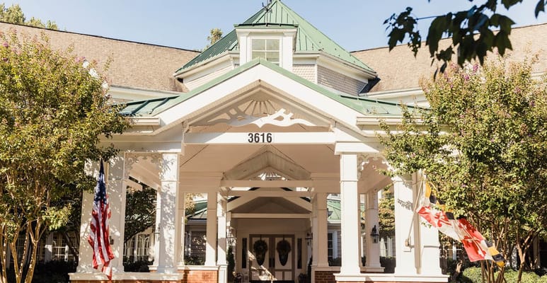 The entrance of the Kensington Park facility with a covered porch