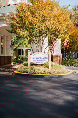 Main entrance sign of The Woodlands facility