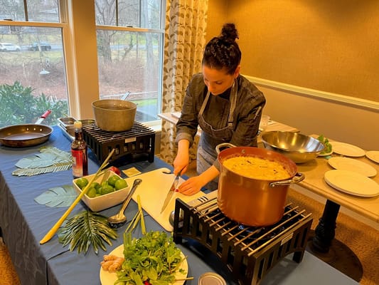 Staff member preparing food in a dining area