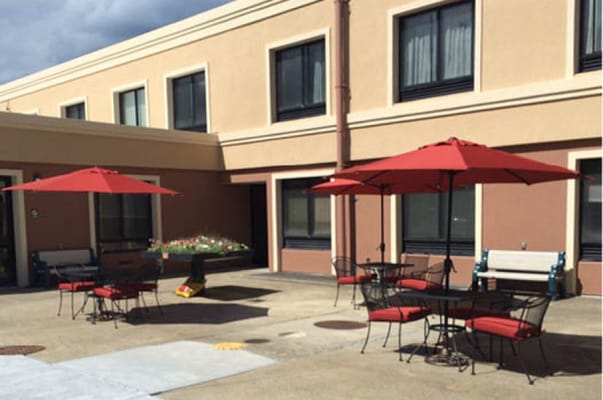 Outdoor seating area with umbrellas and tables